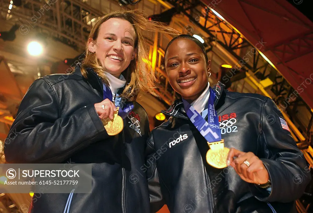 The first winners in the 2002 OLYMPIC WINTER GAMES debut for womens two-man bobsledding. World Class Athlete SPECIALIST Jill Bakken, USA, left, and Vonetta Flowers, of "USA-2" bobsled, show off their newly awarded gold medals presented to them at the medal ceremony in Salt Lake City. The team was not favored going in but ended up breaking a 46 year drought for the United States, winning the Gold over another American team and favored German team, setting a track record in the process. Subject Operation/Series: 2002 OLYMPIC WINTER GAMES Base: Salt Lake City State: Utah (UT) Country: United States Of America (USA)