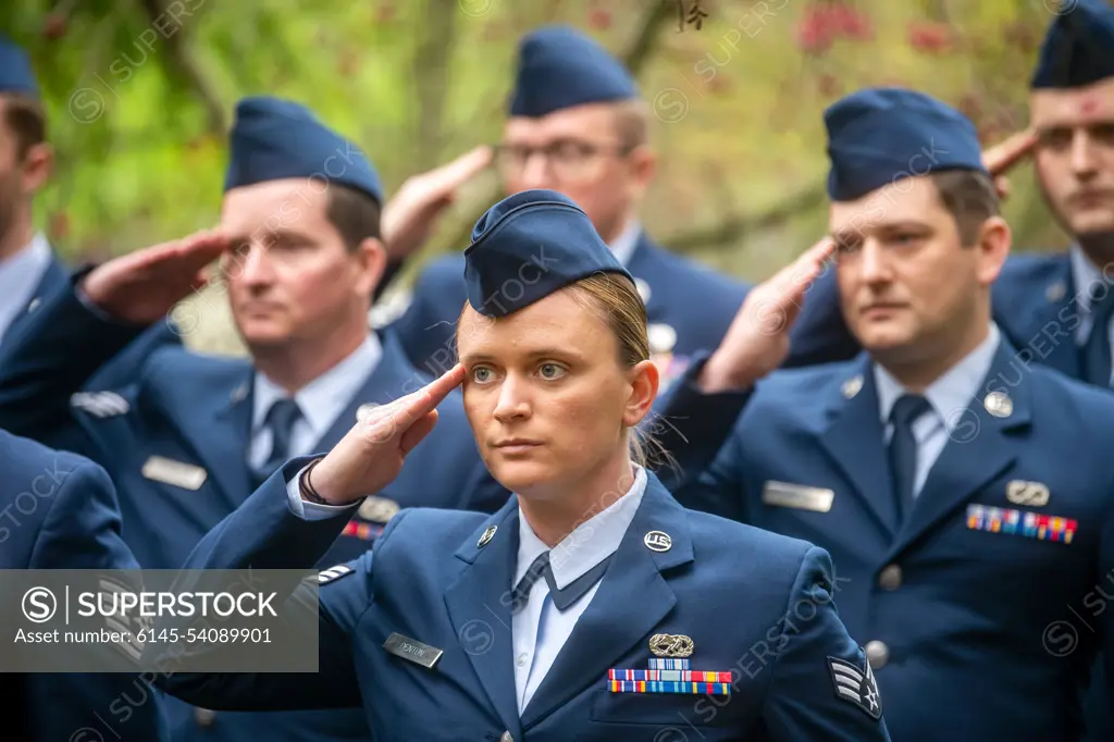 Airmen from the 420th Munitions Squadron, salute during a Remembrance Day ceremony at RAF Welford, England, Nov. 10, 2022. Airmen from the 501st Combat Support Wing, Royal Air Force, and distinguished guests came together to honor the sacrifices of armed forces veterans, past and present.