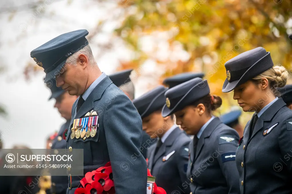 Members of the Royal Air Force bow their heads during a Remembrance Day ceremony at RAF Welford, England, Nov. 10, 2022. Airmen from the 501st Combat Support Wing, RAF, and distinguished guests came together to honor the sacrifices of armed forces veterans, past and present.