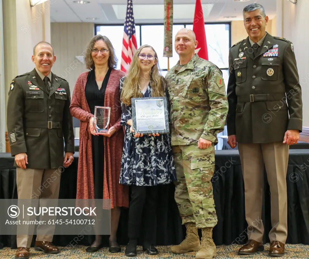 U.S. Army U.S. Army Brig. Gen. Frank Stanco (left), the acting senior commander of Fort Riley, and U.S. Army Col. William McKannay (right), the Fort Riley Garrison commander, present Amanda, Abigail and Chris Stewart (centered left to right) the Military Family Volunteer of the Year award April 21, 2022, at Fort Riley, Kansas. The Steward Family was awarded during Fort Rileys annual Volunteer of the Year award ceremony for their volunteer work with the United Service Organization.