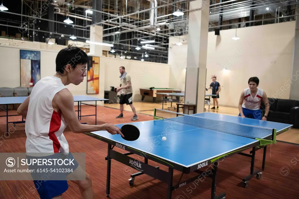 Participants from Team Misawa play table tennis  during the first-ever Sakura Olympics at Misawa Air Base, Japan, April 22, 2022. The Sakura Olympics, which took over seven months to plan, culminated in a month-long event in which U.S. forces and Japan Air Self-Defense Force members competed in over 10 sporting events.