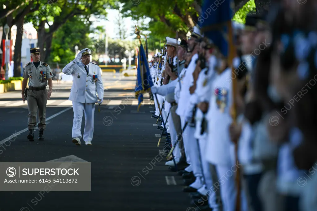 A Victory in Europe Day participant marches and salutes a multilateral formation during a World War II remembrance ceremony outside the Haut-commissariat de la République Tahiti, French Polynesia, May 8, 2022. Exercise Marara 22 will enable USINDOPACOM components to address strategic, readiness, and security cooperation measures by improving mil-to-mil relationships, increasing combined interoperability readiness, and identifying information sharing friction points or gaps, and enhancing HADR response capability development.