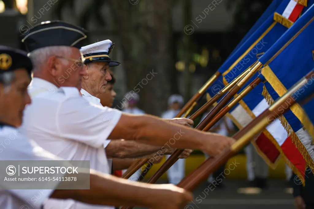 Participants display flags during a Victory in Europe Day World War II remembrance ceremony outside the Haut-commissariat de la République Tahiti, French Polynesia, May 8, 2022. Through exercises and engagements, we improve our ability to work together with our allies and partners and build on our collective strengths.