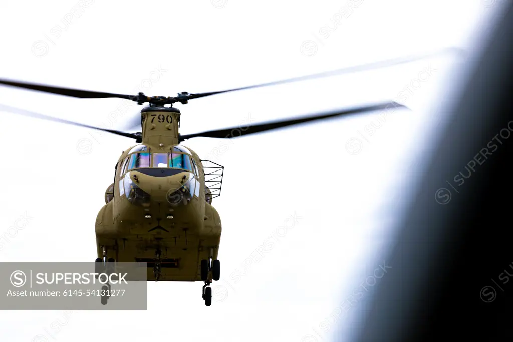 A CH-47F Chinook helicopter from the 2nd Battalion, 104th Aviation Regiment, Connecticut Army National Guard, flies over Nantucket, Massachusetts, June 1, 2022. 1st. Lt. Dalton Peck and Chief Warrant Officer 3 Dylan Brown command the aircraft.