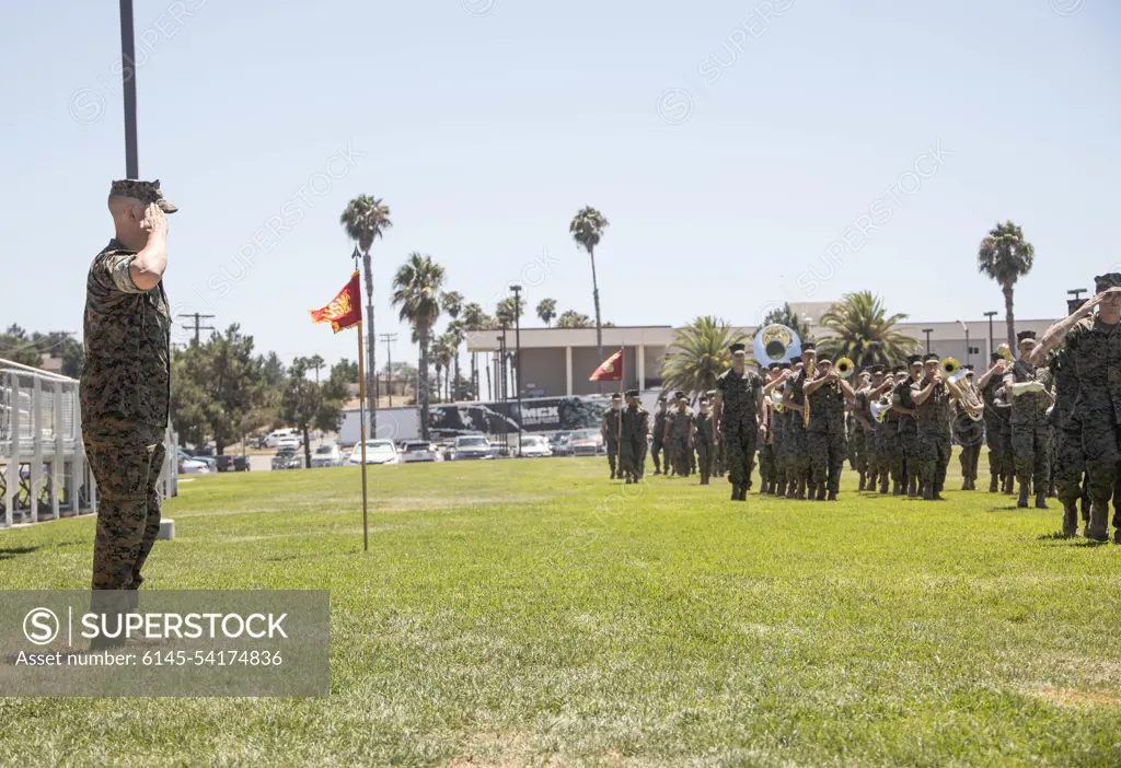 U.S. Marine Corps Col. Matthew Lundgren, the incoming commanding officer of Headquarters Battalion, 1st Marine Division, salutes during the pass in review of a change of command ceremony at Marine Corps Base Camp Pendleton, California, Aug. 5, 2022. During the ceremony, Col. Seth W. B. Folsom relinquished command of the battalion to Lundgren.