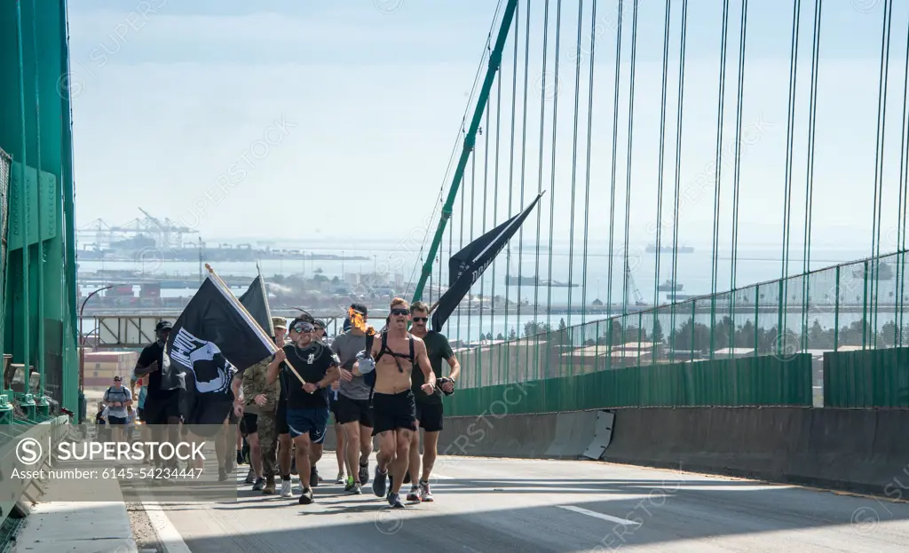 Los Angeles Air Force Base held a remembrance event for National POW/MIA Recognition Day that began on Sept. 15 and ended on Sept. 16 with a 54 mile torch run and wreath laying ceremony.  The torch lighting and run began at Terminal Island, California, and ended at the base. Various base and community organizations carried the torch while running relay legs. The Los Angeles Air Force Base honor guard presented the colors for the opening ceremony on Sept. 16, 2022. Col. Mia Walsh, Commander of Space Base Delta 3, hands the Most Miles Completed trophy to volunteers and the top runners.