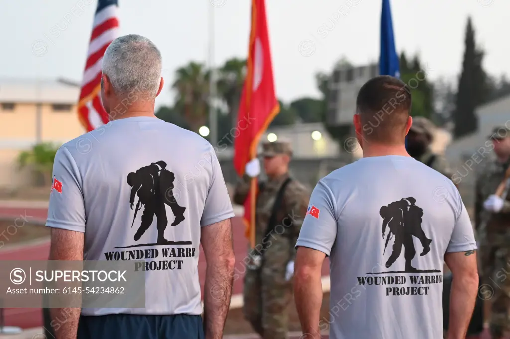 Col. Kevin McCaskey (left), 39th Air Base Wing vice commander, and Chief Master Sgt. Justin Stoltzfus, 39th ABW command chief, stand at attention during a POW/MIA remembrance ceremony at Incirlik Air Base, Turkey, Sept. 16, 2022. Service members and civilians gathered for a 24-hour run in honor of National POW/MIA Recognition Day. Attendees continued to run until the end of the event to remember and honor those Americans who were prisoners of war and those who served and never returned home.