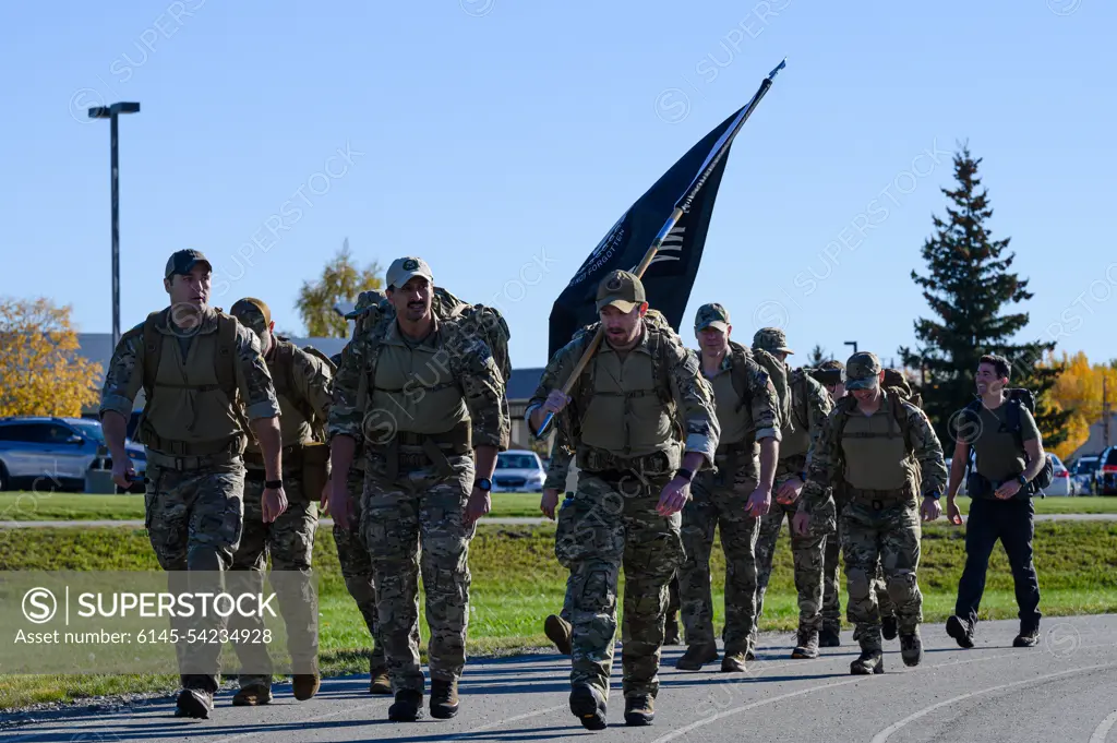 U.S. Airmen assigned to the 3rd Air Support Operations Squadron participate in the Prisoners of War/Missing in Action remembrance run on Eielson Air Force Base, Alaska, Sept. 16, 2022. The run was in observance of National POW/MIA Recognition Day, a day honoring service members who are still missing or were prisoners of war.