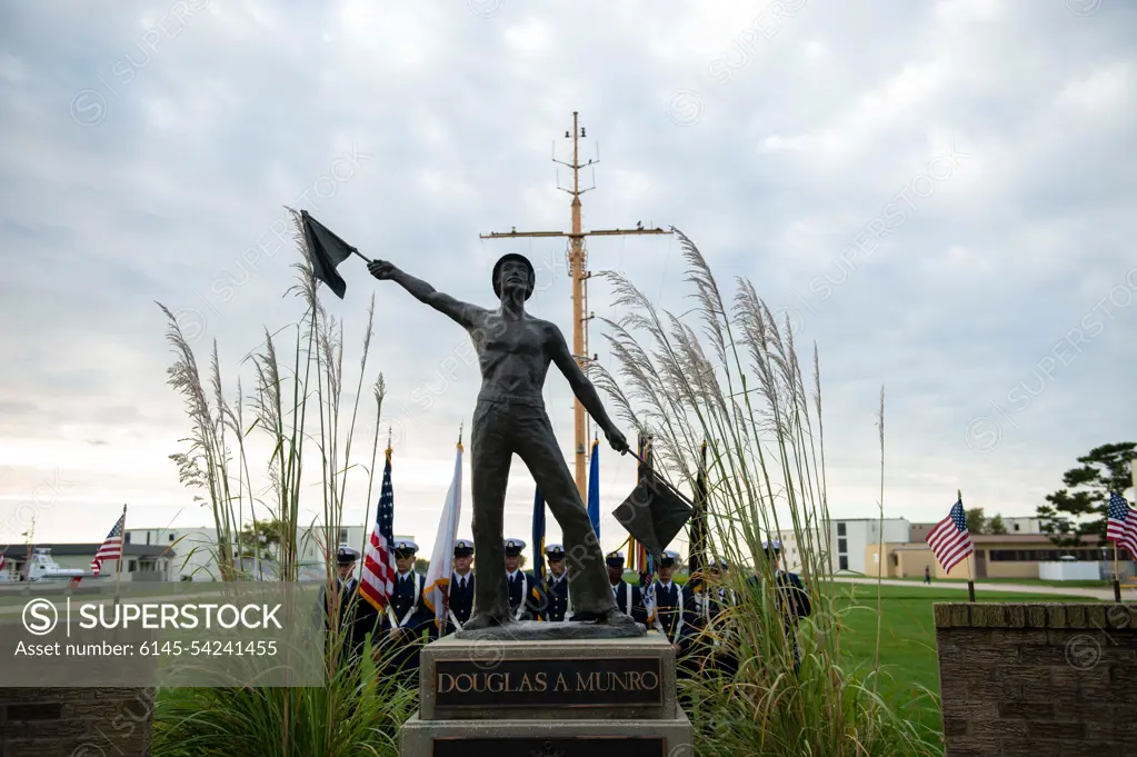 CAPE MAY, N.J. - Personnel at U.S. Coast Guard Training Center Cape May hold a remembrance ceremony for Petty Officer 1st Class Douglas Munro at his statue on the parade field, Sept. 27, 2022.U.S. Coast Guard men and women carry out a wide variety of diverse missions every day. Protecting people and commerce on the sea, protecting the sea itself, and protecting the country from threats aboard. We focus on present-day operations and readiness and strive to be prepared for tomorrow, but certain times compel us, and all Americans, to reflect on our history and heritage. The 80th anniversary of Munros extraordinarily heroic actions at Guadalcanal is such a day.