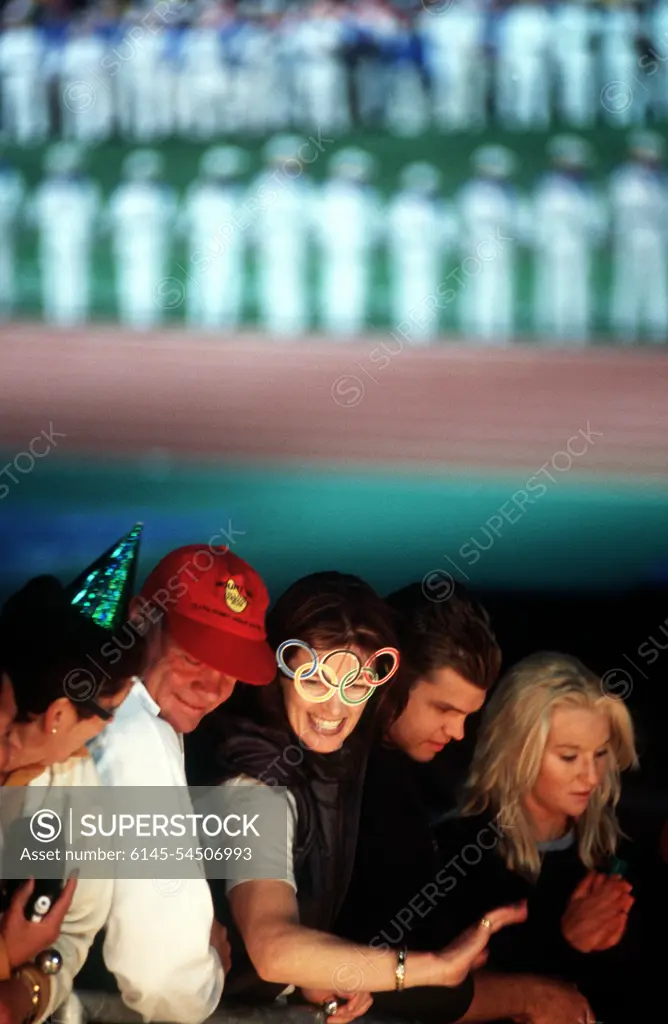 Spectators wave as athletes (Not shown) stream onto the field at Olympic Stadium during the Closing Ceremonies on the last day of the Sydney 2000 Olympics. Numerous US Department of Defense personnel are taking part in the Olympics, from coaches and support staff to athletes competing in various venues. Spectators wave as athletes (Not shown) stream onto the field at Olympic Stadium during the Closing Ceremonies on the last day of the Sydney 2000 Olympics.  Numerous US Department of Defense personnel are taking part in the Olympics, from coaches and support staff to athletes competing in various venues.