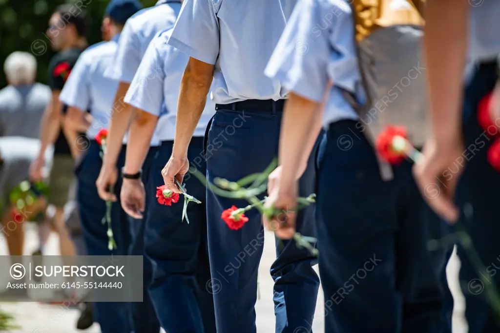 Visitors participate in the first Flowers of Remembrance Day at the Tomb of the Unknown Soldier at Arlington National Cemetery, Arlington, Va., May 28, 2022. Visitors were given the opportunity to cross the plaza and place a flower in front of the Tomb of the Unknown Soldier. This event pays homage to the first official Decoration Day, now known as Memorial Day, which originally took place at the cemetery in 1868 as a way to honor the sacrifices of those who fought and died in the Civil War.