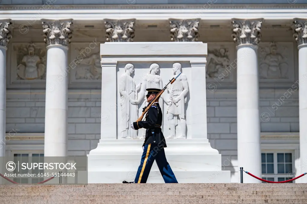 A tomb guard walks the mat during the first Flowers of Remembrance Day at the Tomb of the Unknown Soldier at Arlington National Cemetery, Arlington, Va., May 28, 2022. Visitors were given the opportunity to cross the plaza and place a flower in front of the Tomb of the Unknown Soldier. This event pays homage to the first official Decoration Day, now known as Memorial Day, which originally took place at the cemetery in 1868 as a way to honor the sacrifices of those who fought and died in the Civil War.