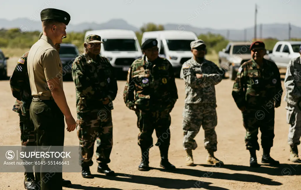 Capt. Curran Boyce, a platoon commander with 3rd Light Armored Reconnaissance Battalion, 1st Marine Division, talks to local veterans before the dedication ceremony of the Michael A. Noline Community Building, honoring Pfc. Michael A. Noline, at the San Carlos Apache Indian Reservation, Arizona, May 14, 2022. Noline, a member of the San Carlos Apache Tribe, who served as a light armored vehicle (LAV) crewman for 3rd Light Armored Infantry Battalion, was killed in action in support of Operation Desert Storm, Jan. 26, 1991.