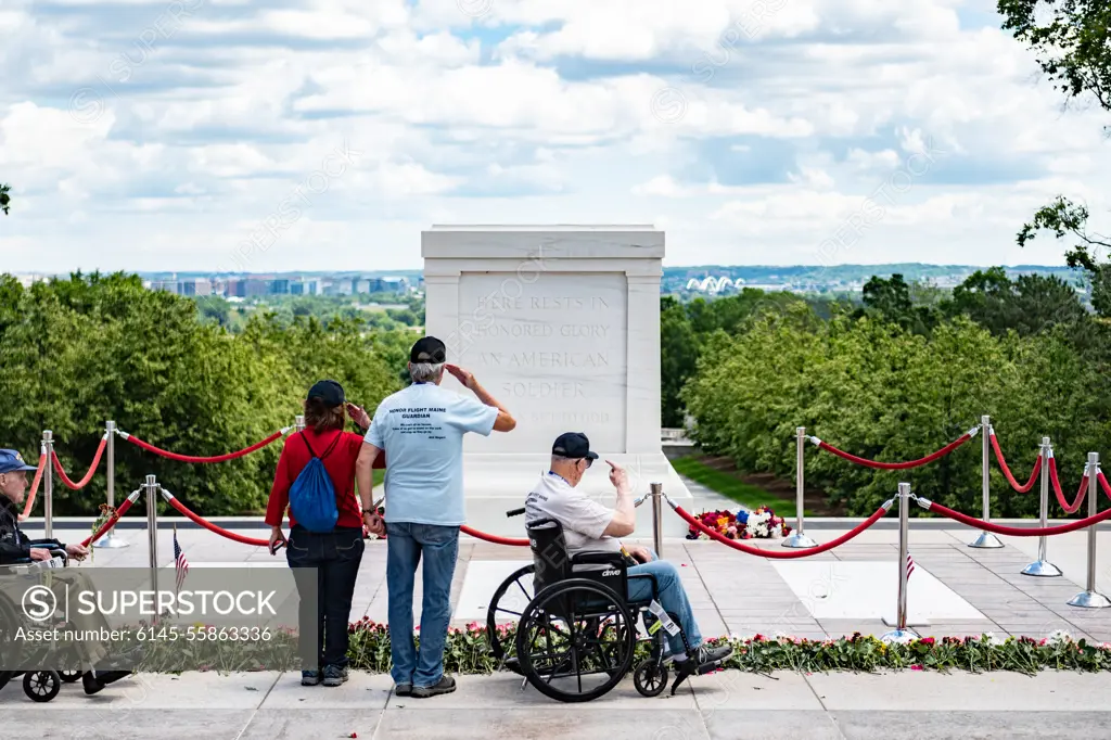 Veterans from an honor flight participate in the first Flowers of Remembrance Day at the Tomb of the Unknown Soldier at Arlington National Cemetery, Arlington, Va., May 28, 2022. Visitors were given the opportunity to cross the plaza and place a flower in front of the Tomb of the Unknown Soldier. This event pays homage to the first official Decoration Day, now known as Memorial Day, which originally took place at the cemetery in 1868 as a way to honor the sacrifices of those who fought and died in the Civil War.