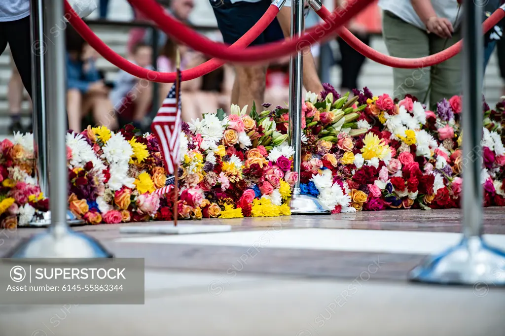 Visitors participate in the first Flowers of Remembrance Day at the Tomb of the Unknown Soldier at Arlington National Cemetery, Arlington, Va., May 28, 2022. Visitors were given the opportunity to cross the plaza and place a flower in front of the Tomb of the Unknown Soldier. This event pays homage to the first official Decoration Day, now known as Memorial Day, which originally took place at the cemetery in 1868 as a way to honor the sacrifices of those who fought and died in the Civil War.