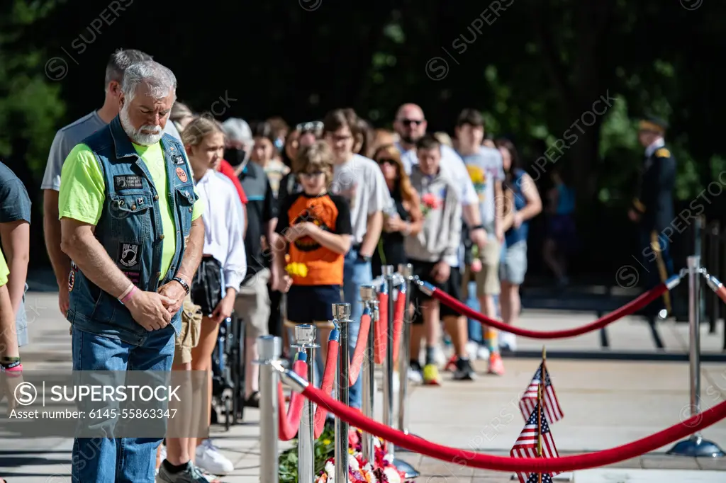 Visitors participate in the first Flowers of Remembrance Day at the Tomb of the Unknown Soldier at Arlington National Cemetery, Arlington, Va., May 28, 2022. Visitors were given the opportunity to cross the plaza and place a flower in front of the Tomb of the Unknown Soldier. This event pays homage to the first official Decoration Day, now known as Memorial Day, which originally took place at the cemetery in 1868 as a way to honor the sacrifices of those who fought and died in the Civil War.