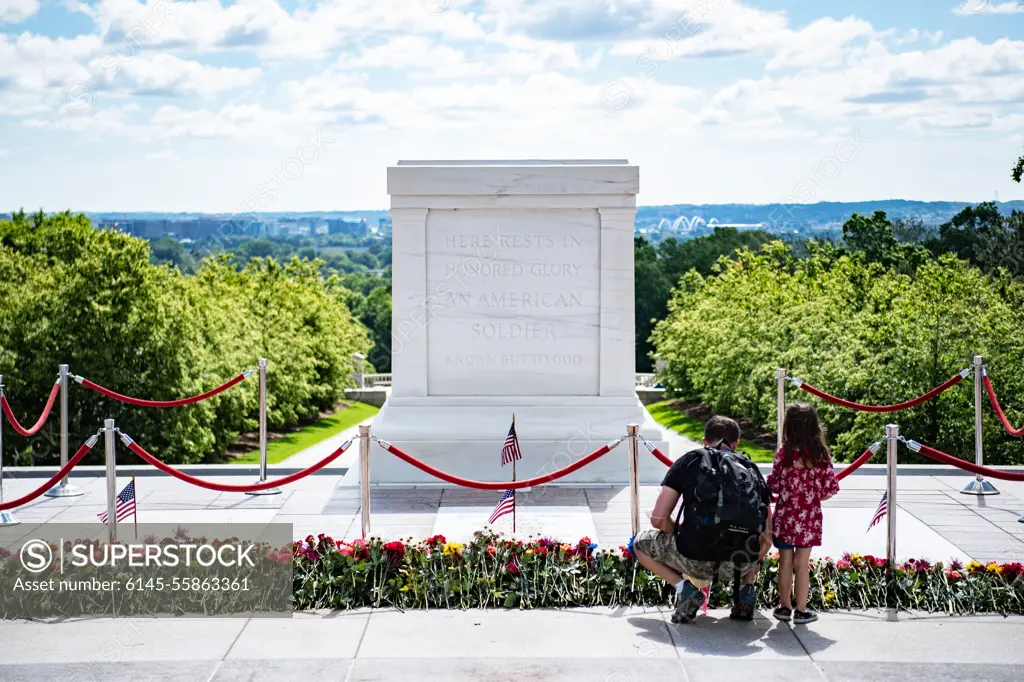 Visitors participate in the first Flowers of Remembrance Day at the Tomb of the Unknown Soldier at Arlington National Cemetery, Arlington, Va., May 28, 2022. Visitors were given the opportunity to cross the plaza and place a flower in front of the Tomb of the Unknown Soldier. This event pays homage to the first official Decoration Day, now known as Memorial Day, which originally took place at the cemetery in 1868 as a way to honor the sacrifices of those who fought and died in the Civil War.