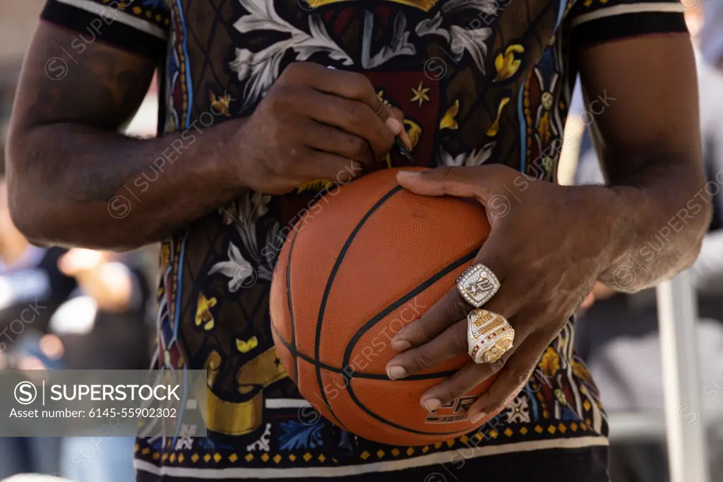 Kawhi Leonard, an American professional basketball player in the National Basketball Association, signs a basketball during a meet and greet event at the Camp Margarita Active Duty Center on Marine Corps Base Camp Pendleton, California, Sept. 21, 2022. Marine Corps Community Services hosts events and activities across the base to boost morale and promotes camaraderie between Marines.