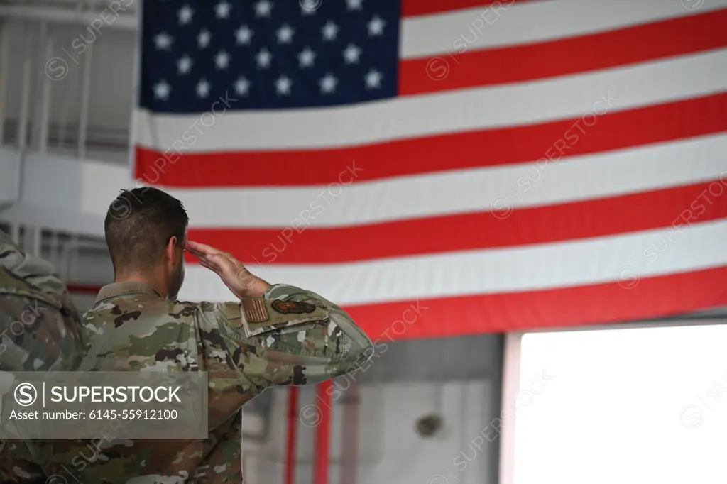 U.S. Air Force Maj. Joseph Carpentieri, commander, Base Defense Squadron, salutes during the 9/11 Day Remembrance Ceremony Sept. 11, 2022 at Stewart Air National Guard Base, Newburgh, New York. Carpentieri, while in formation, saluted during the singing of the national anthem.