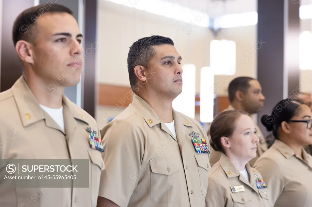 U.S. Navy Chief Petty Officer Andrew Nicolas, fleet marine force technician, Bravo Surgical Company, 3d Medical Battalion, stands at attention during the 130th Chief Petty Officer Birthday cake cutting ceremony, Marine Corps Base Hawaii, March 31, 2023. The celebration commemorated 130 years of lineage for Chief Petty Officers across MCBH.