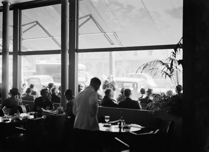 Poll photo collection. Report Paris. Waiter at work in a cafe. 1935. France, Paris