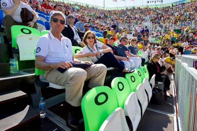 U.S. Secretary of State John Kerry and U.S. Ambassador to Brazil Liliana Ayalde watch an Olympic men's beach volleyball game on the Copacobana beach in Rio de Janiero, Brazil, while they and their fellow members of the U.S. Presidential Delegation visit the Summer Olympics on August 6, 2016.