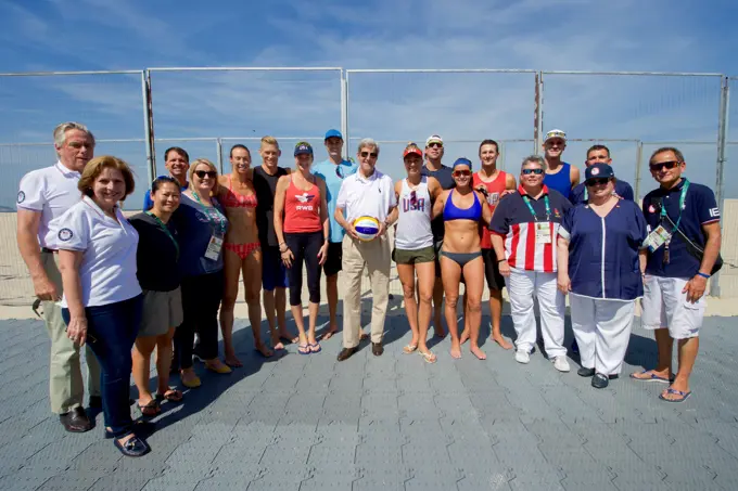 U.S. Secretary of State John Kerry poses for a group photo with U.S. Olympic women's beach volleyball players on the Copacobana beach in Rio de Janiero, Brazil, on August 6, 2016, as he and his fellow members of the U.S. Presidential Delegation attend the Summer Olympics.