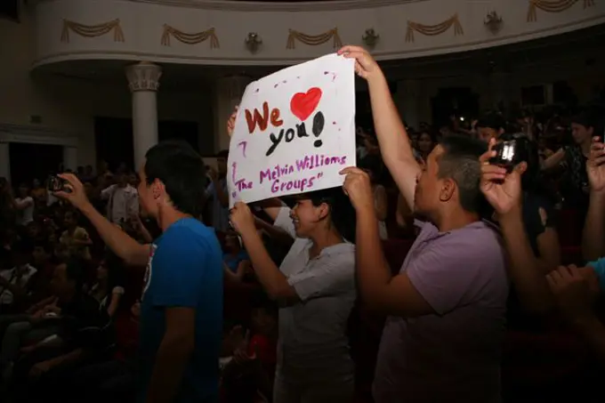 Fans hold up posters during the Melvin Williams Group's concert in Turkmenabat, Turkmenistan, on June 22, 2011. The Melvin Williams Group is visiting Turkmenistan from June 21-26, 2011, as part of the U.S. Embassy�s annual American Culture Days celebration.