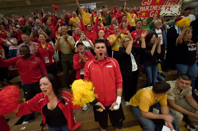 Fans and spectators of the all Marine sitting volleyball team erupt after the team scored the game wining point of the inaugural Warrior Games sitting volleyball competition May 13, 2010. The Marines won the gold medal defeating the Army 15 to 9 in the last game of a best-out-of-three championship.