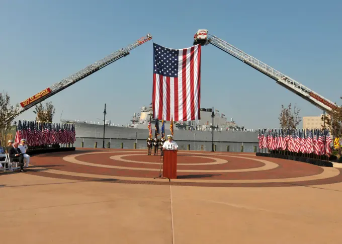 110911-N-NL541-339NORFOLK (Sept. 11, 2011) Adm. John C. Harvey Jr. addresses the citizens of the City of Norfolk in front of the guided-missile destroyer USS Cole (DDG 67) during a 9/11 Remembrance ceremony at Town Point Park. The City of Norfolk hosted an all-day healing and remembrance ceremony to mark the 10th anniversary of the Sept. 11, 2001, terrorist attacks on the U.S.