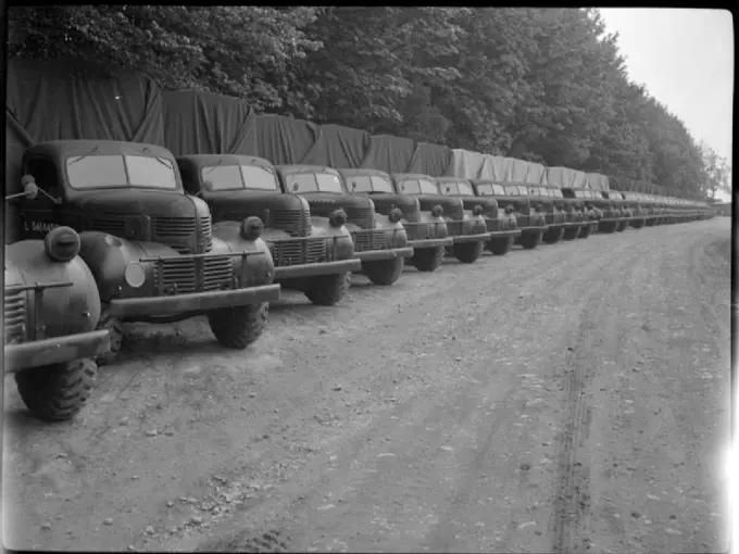 Invasion Build-up- Preparations For the D-day Landings, UK, 1944 A row of trucks waits at an Ordnance Depot, somewhere in Britain, for collection by army units and transportation to the Second Front.