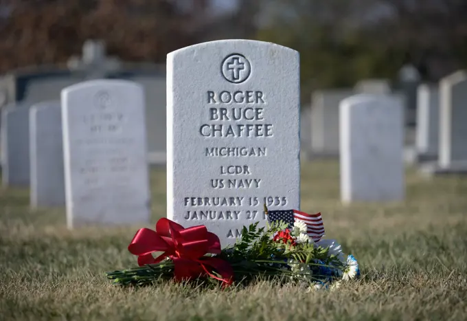 The grave marker of Roger Chaffee, from Apollo 1, is seen after a wreath laying ceremony that was part of NASA's Day of Remembrance, Thursday, Jan. 27, 2022, at Arlington National Cemetery in Arlington, Va.  Wreaths were laid in memory of those men and women who lost their lives in the quest for space exploration.