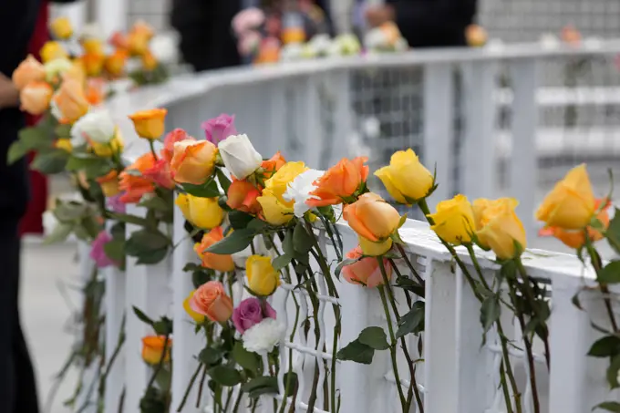 Flowers are placed near the Space Mirror Memorial at the Kennedy Space Center Visitor Complex. The names of fallen astronauts from Apollo 1, Challenger and Columbia, as well as the astronauts who perished in training and commercial airplane accidents are emblazoned on the monument. During the annual Day of Remembrance, spaceport employees and guests join others throughout NASA honoring the contributions of astronauts who have perished in the conquest of space.