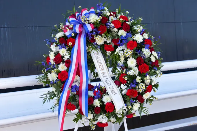 A memorial wreath stands before the Space Mirror Memorial at the Kennedy Space Center Visitor Complex during this years Day of Remembrance ceremony. Each year, Kennedy employees and guests gather with others throughout NASA to honor those astronauts who have fallen in the pursuit of space exploration.