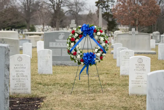 The grave markers of Virgil "Gus" Grissom and Roger Chaffee, from Apollo 1, are seen before a wreath laying ceremony that was part of NASA's Day of Remembrance, Thursday, Feb. 7, 2019, at Arlington National Cemetery in Arlington, Va.  Wreaths were laid in memory of those men and women who lost their lives in the quest for space exploration.