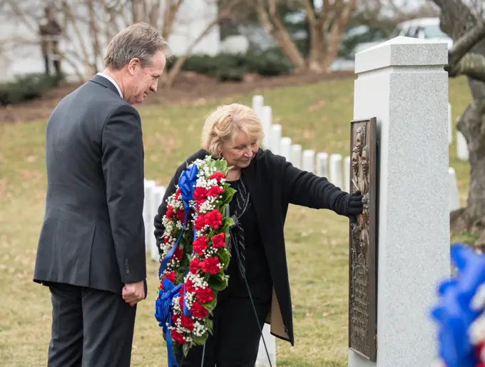 John Warnack, left, and June Scobee-Rodgers, widow of Challenger Commander Dick Scobee, visit the Space Shuttle Challenger Memorial after a wreath laying ceremony that was part of NASA's Day of Remembrance, Thursday, Feb. 7, 2019, at Arlington National Cemetery in Arlington, Va. Wreaths were laid in memory of those men and women who lost their lives in the quest for space exploration.