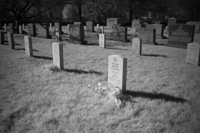 The grave markers of Roger Chaffee, and Virgil "Gus" Grissom and from Apollo 1, are seen in this black and white infrared photograph after a wreath laying ceremony that was part of NASA's Day of Remembrance, Thursday, Jan. 28, 2021, at Arlington National Cemetery in Arlington, Va.  Wreaths were laid in memory of those men and women who lost their lives in the quest for space exploration.