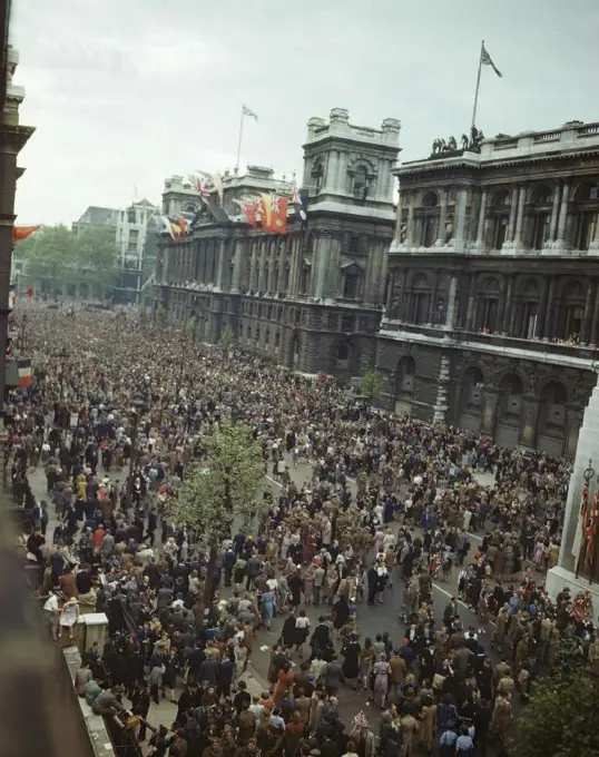 Ve Day Celebrations in London, 8 May 1945 View of the crowd in front of the Ministry of Health building in Whitehall. The Prime Minister addressed the crowd from the balcony, which, like the roof of the building, is decorated with flags. On the right is the Cenotaph.