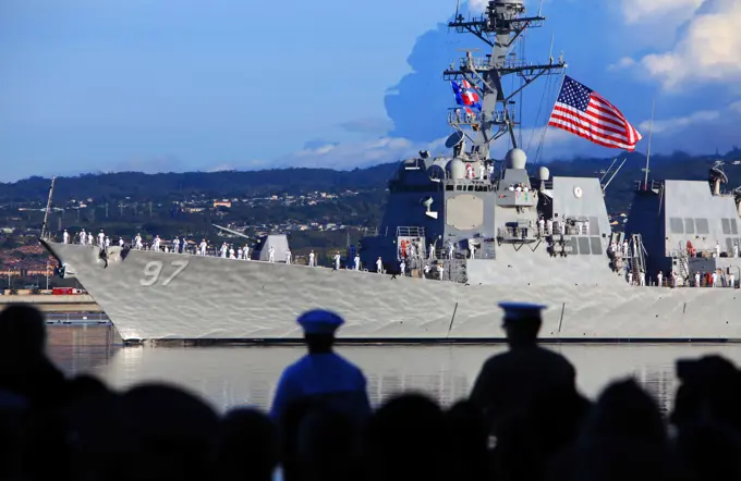 The USS Halsey (DDG-97) conducts a pass-in-review during the 75th National Pearl Harbor Remembrance Day Commemoration Ceremony at Joint base Pearl Harbor-Hickam, Hawaii, Dec. 7, 2016. Civilians, veterans, and service members came together to remember and pay their respect to those who fought and lost their lives during the attack on Pearl Harbor.