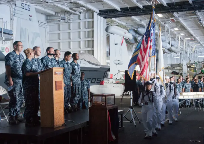 PACIFIC OCEAN (Sept. 11, 2012) The color guard aboard the aircraft carrier USS George Washington (CVN 73) presents the colors during a Patriot Day remembrance of the events of Sept. 11, 2001.  George Washington and its embarked air wing, Carrier Air Wing (CVW) 5, provide a combat-ready force that protects and defends the collective maritime interest of the U.S. and its allies and partners in the Asia-Pacific region.