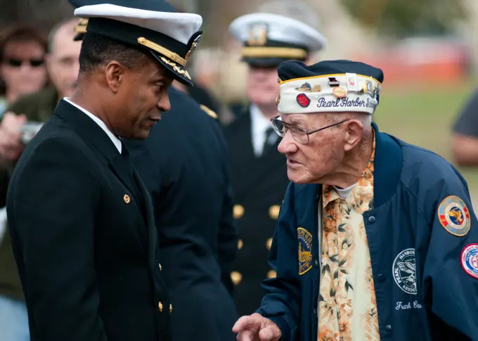 111207-N-OV802-055VIRGINIA BEACH, Va. (Dec.7, 2011) Frank Chebetar, president of the Pearl Harbor Survivors Association, Tidewater Chapter 2, speaks with Capt. Charles L. Stuppard, base commander of Joint Expeditionary Base Little Creek-Fort Story, before a Pearl Harbor remembrance ceremony. The Pearl Harbor Survivors Association, founded in 1958, is an organization dedicated to the remembrance of the attacks on Pearl Harbor and those who gave their lives that day.