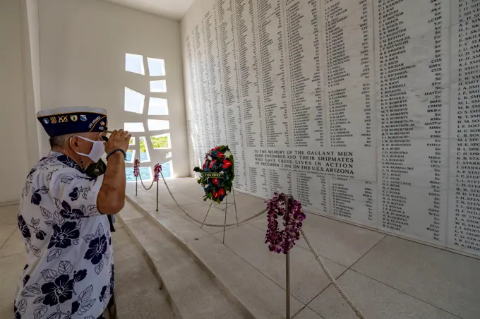 PEARL HARBOR (Dec. 7, 2020) Henry Lee, a Pearl Harbor survivor and U.S. Army veteran, renders honors in the USS Arizona Memorial shrine room as part of the 79th Pearl Harbor Day Remembrance Day ceremony in Honolulu, Hawaii. The theme of the 79th Pearl Harbor Day Remembrance ceremony, Above and Beyond the Call,” pays tribute to the Soldiers, Marines, Coast Guardsmen and Sailors defending Oahu, as well as the civilians caught in the crossfire of the opening battle of the United States involvement in World War II.