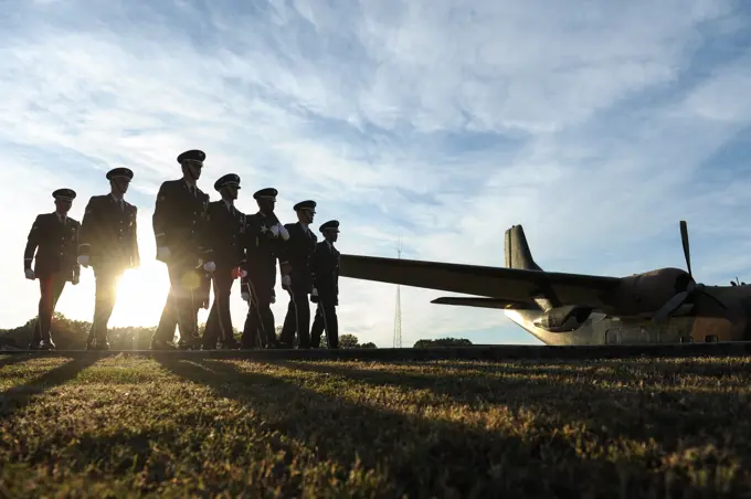 Ceremonial guardsmen retire the colors during a Veterans Day retreat ceremony Nov. 10, 2014, at Little Rock Air Force Base, Ark. Veterans Day is observed Nov. 11 and was originally known as Armistice Day or Remembrance Day.