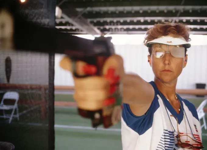 Army SPECIALIST 5 Ruby E. Fox from Parker, Arizona, participates in the sport pistol competition at the 1984 Summer Olympics. She won a silver medal for her performance in the event. Base: Chino State: California (CA) Country: United States Of America (USA)