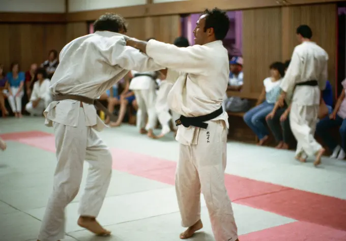 Army Captain Leo White, left, from Fort Carson, Colorado, practices with another judo team member for competition at the 1984 Summer Olympics. Base: Los Angeles State: California (CA) Country: United States Of America (USA)