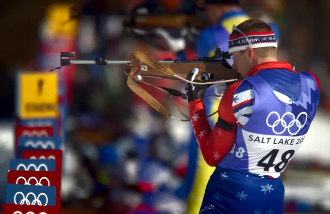 World Class Athlete SPECIALIST (SPC) Jeremy Teela, USA, takes aim with his .22 caliber, bolt-action rifle at the range during the men's 20km individual Biathlon event at Soldier hollow in Midway, Utah during the 2002 WINTER OLYMPIC GAMES. SPC Teela finished with a personal best, two missed targets out of five, which led him to a 14th place finish, the best in American history for the Olympic Games. Subject Operation/Series: 2002 WINTER OLYMPIC GAMES Base: Midway State: Utah (UT) Country: United States Of America (USA)