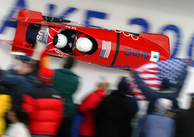 Bobsled Driver Todd Hays and brakeman Army reservist First Lieutenant Garret Hines, USA, of USA-1 hurl their way down the track at the Utah Olympic Park during the Men's two-man bobsled at the 2002 OLYMPIC WINTER GAMES. Subject Operation/Series: 2002 OLYMPIC WINTER GAMES Base: Park City State: Utah (UT) Country: United States Of America (USA)