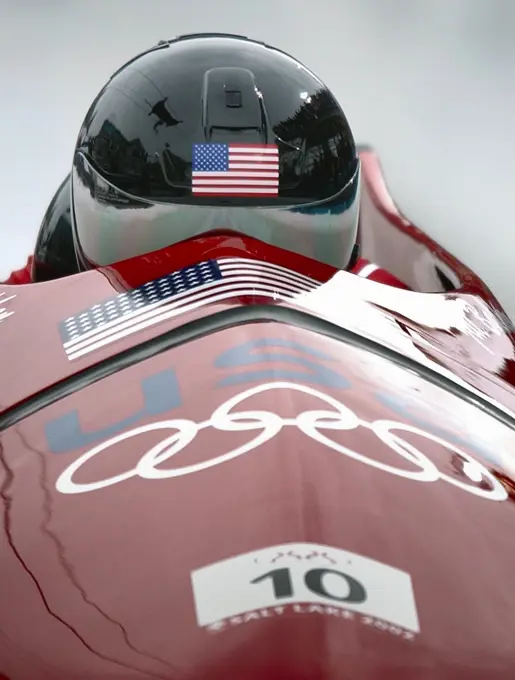 Competing in the 2002 OLYMPIC WINTER GAMES debut for womens bobsledding, World Class Athlete SPECIALIST Jill Bakken, USA, drives the "USA-2" bobsled for the first of two runs in the event. The team was not favored going in but ended up breaking a 46 year drought for the United States and winning the Gold over another American team and favored German team, setting a track record in the process. Subject Operation/Series: 2002 OLYMPIC WINTER GAMES Base: Park City State: Utah (UT) Country: United States Of America (USA)