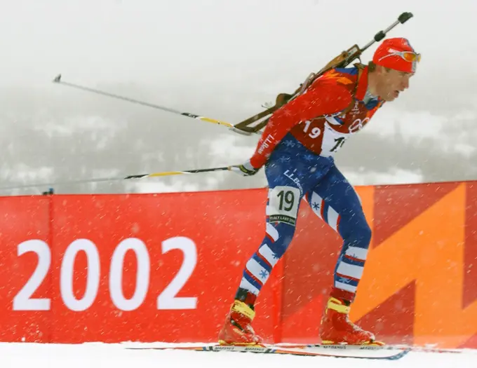 With his .22 caliber, bolt-action rifle slung on his back, World Class Athlete SPECIALIST Jeremy Teela, USA, works his way around the course, on skis, during the first leg of the men's 4 x 7.5km Biathlon Relay competition at Soldier Hollow in Midway, Utah, during the 2002 WINTER OLYMPIC GAMES. The Relay competition consists of four team members; each must ski 7.5 km, with two firing bouts, one prone and one standing, each bout with unsupported rifle. The United States would finish the race in 15th place, 6:44.8 behind the leader. Subject Operation/Series: 2002 WINTER OLYMPIC GAMES Base: Midway State: Utah (UT) Country: United States Of America (USA)