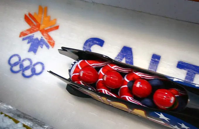 (Right to left) Pilot Brian Shimer, World Class Athletes SPECIALIST Mike Kohn, USA, and SPECIALIST Doug Sharp, USA, with brakeman Dan Steele speed down the track at Utah Olympic Park in Park City, Utah, during the second heat of the men's four-man bobsled in the 2002 WINTER OLYMPIC GAMES. Subject Operation/Series: 2002 WINTER OLYMPIC GAMES Base: Park City State: Utah (UT) Country: United States Of America (USA)